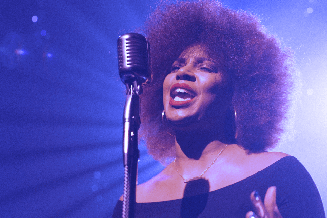 Woman singing on stage