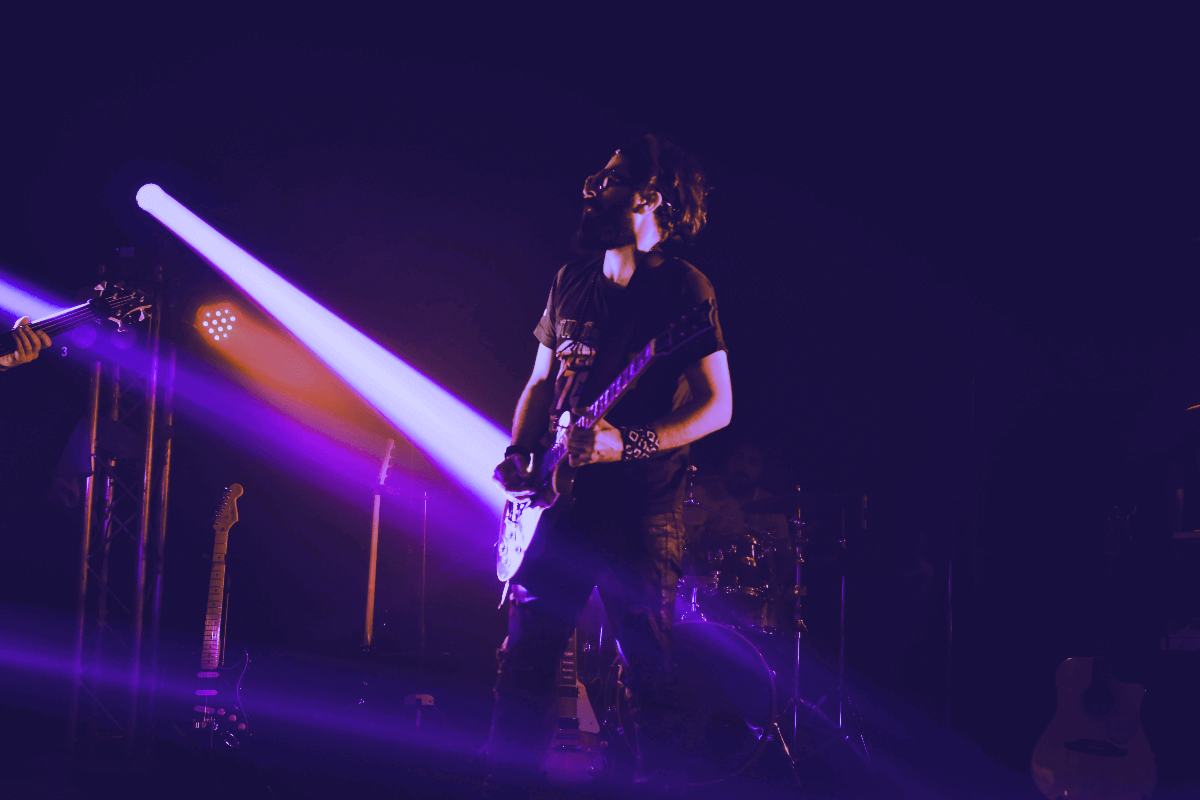 Man playing guitar on stage