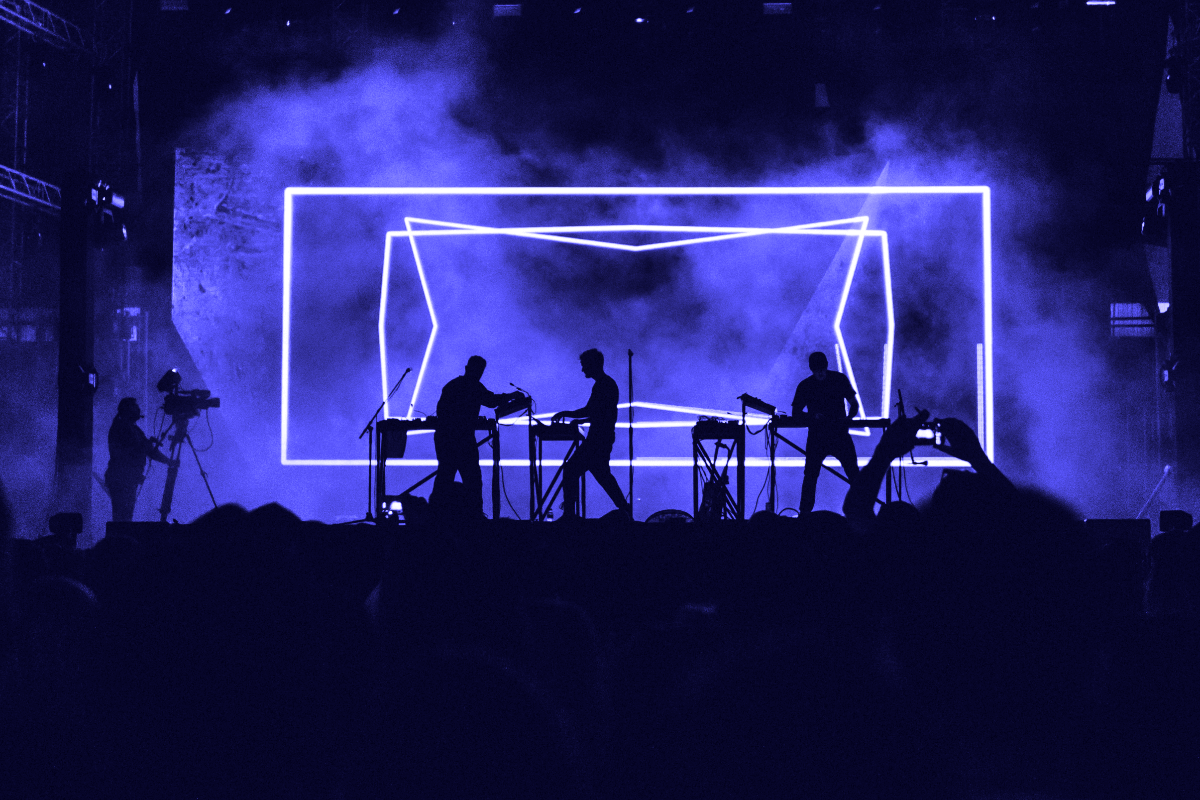 Band on stage with lights and haze